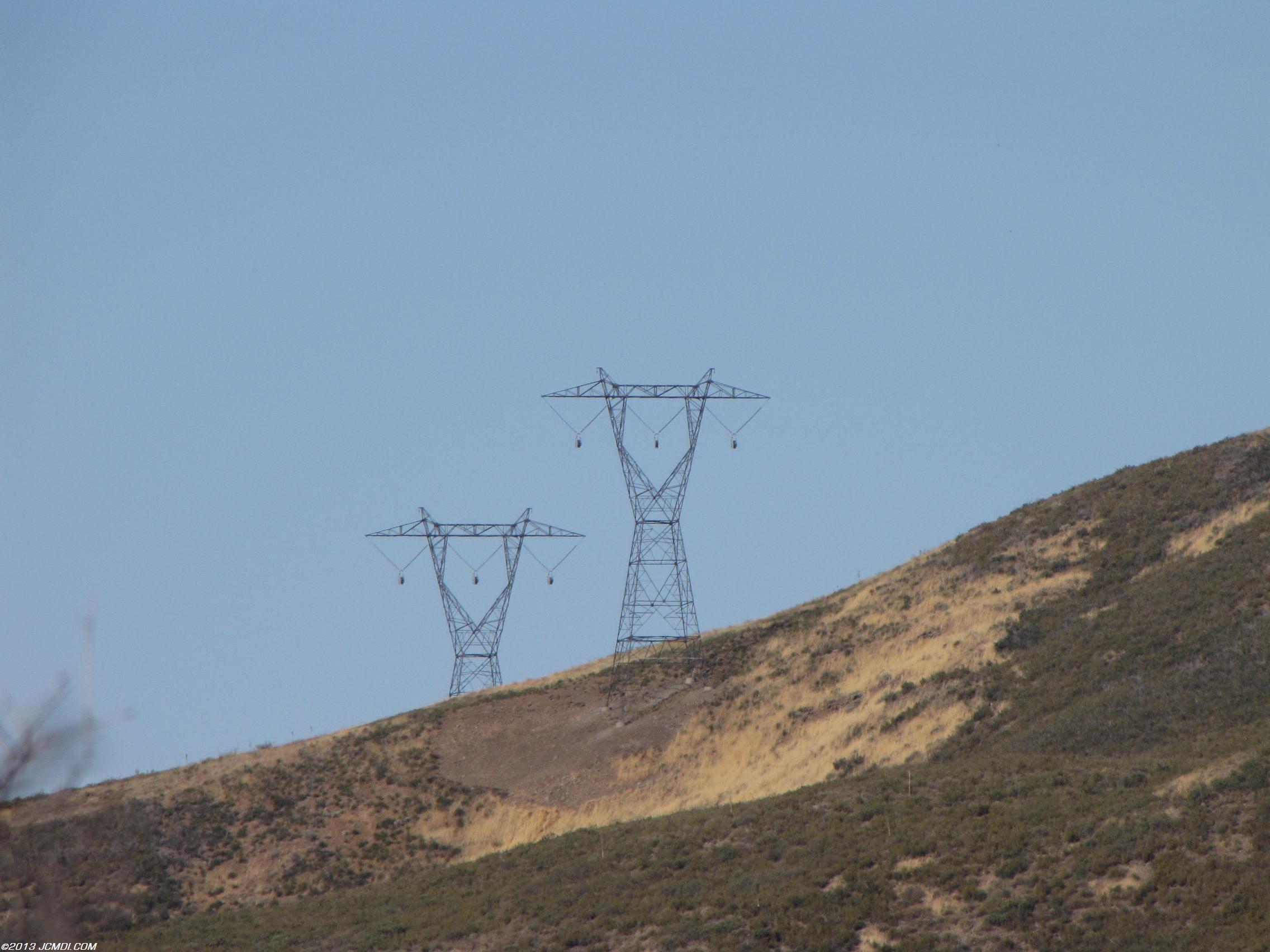 High voltage tower with temporary pulleys for cable pulling